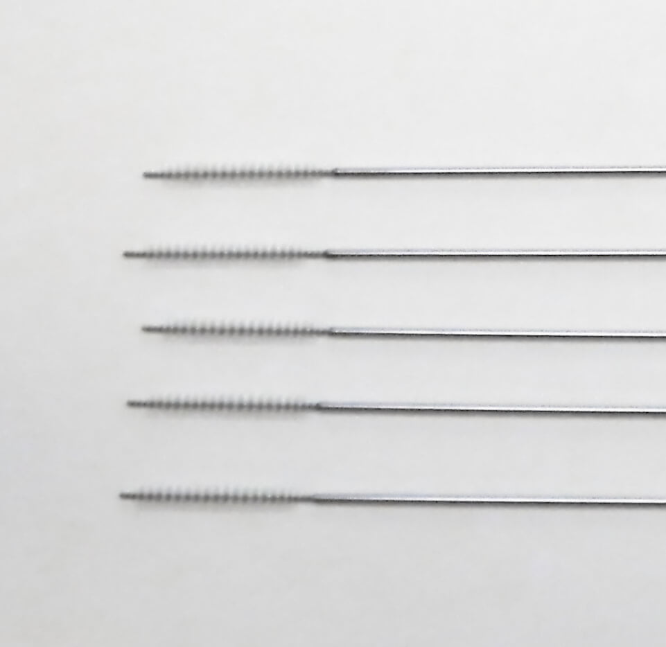cleaning brushes for reusable needle guides
